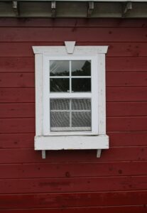 White window on red wooden wall in ohio