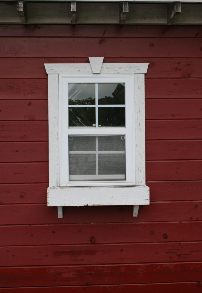 White window on red wooden wall in ohio